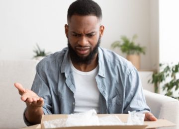 man disappointed in box