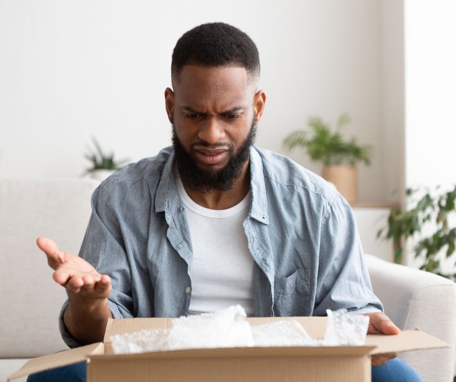 man disappointed in box